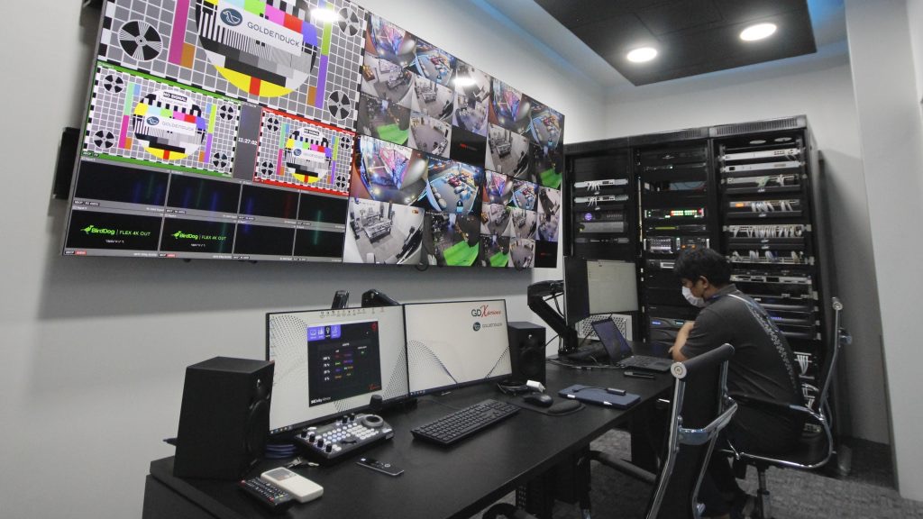 Security control room with a live video wall and server racks